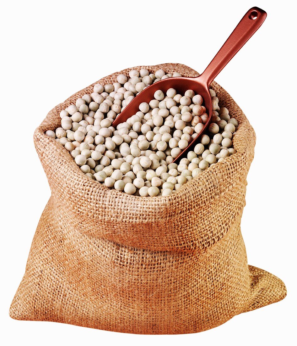 Chick-peas in a jute sack with scoop