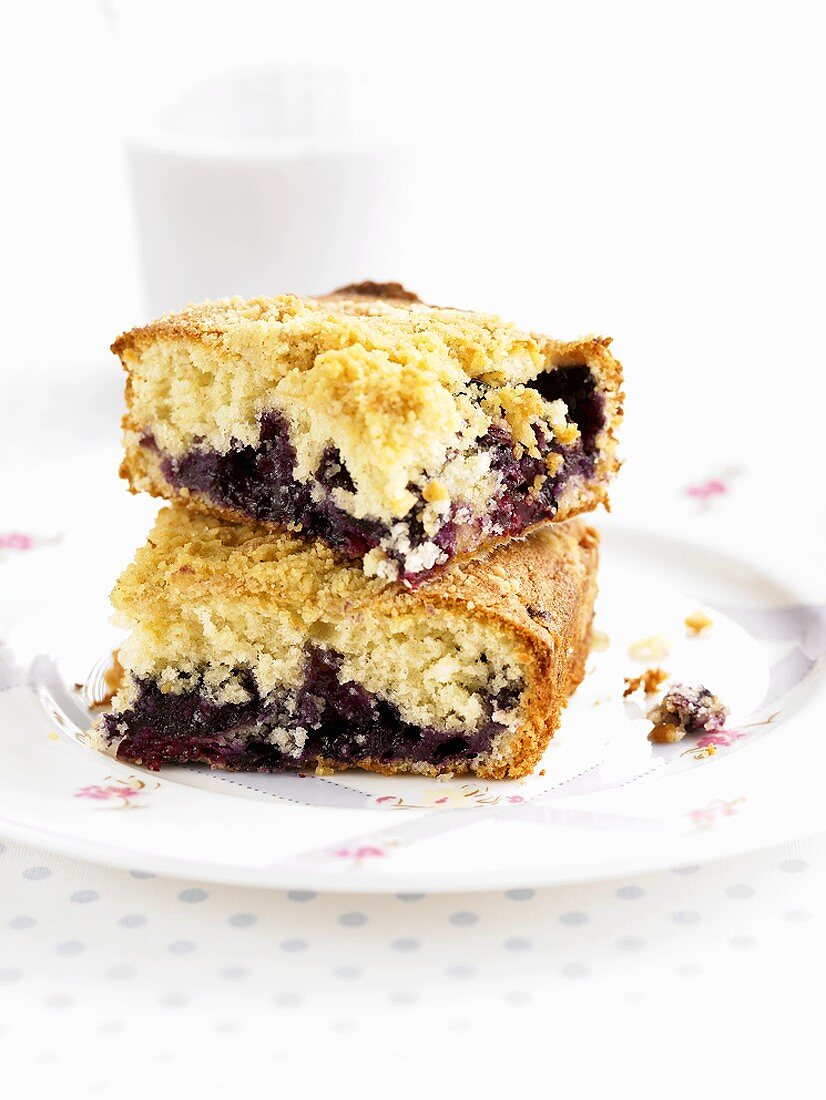 Two pieces of blueberry crumble cake