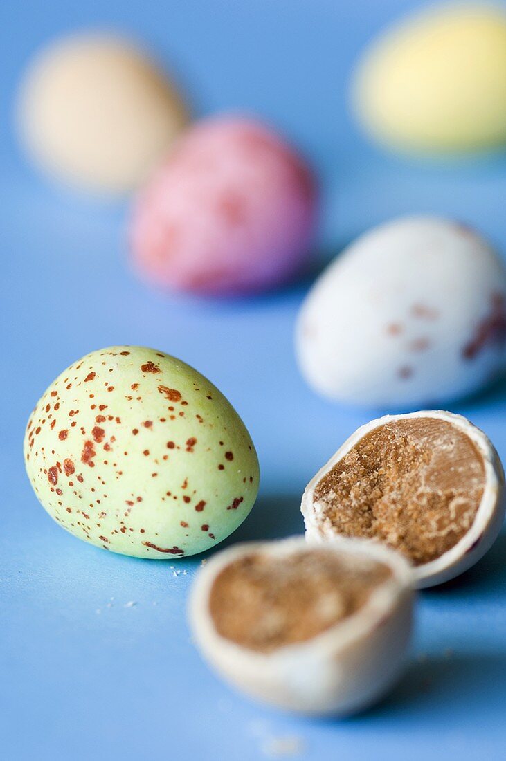 Chocolate eggs with pastel-covered coating