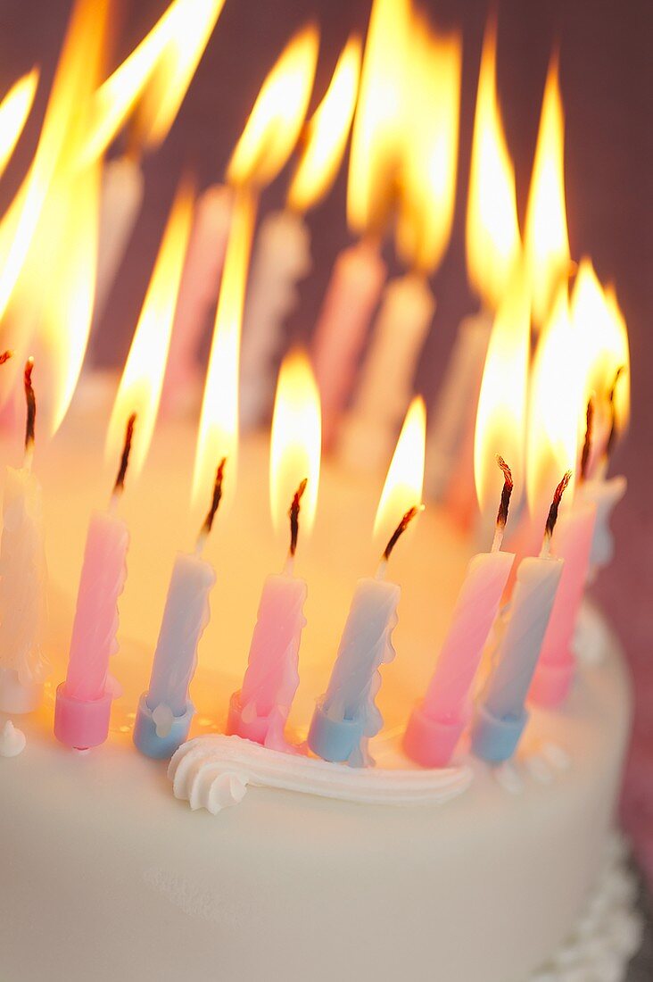 Burning candles on a birthday cake