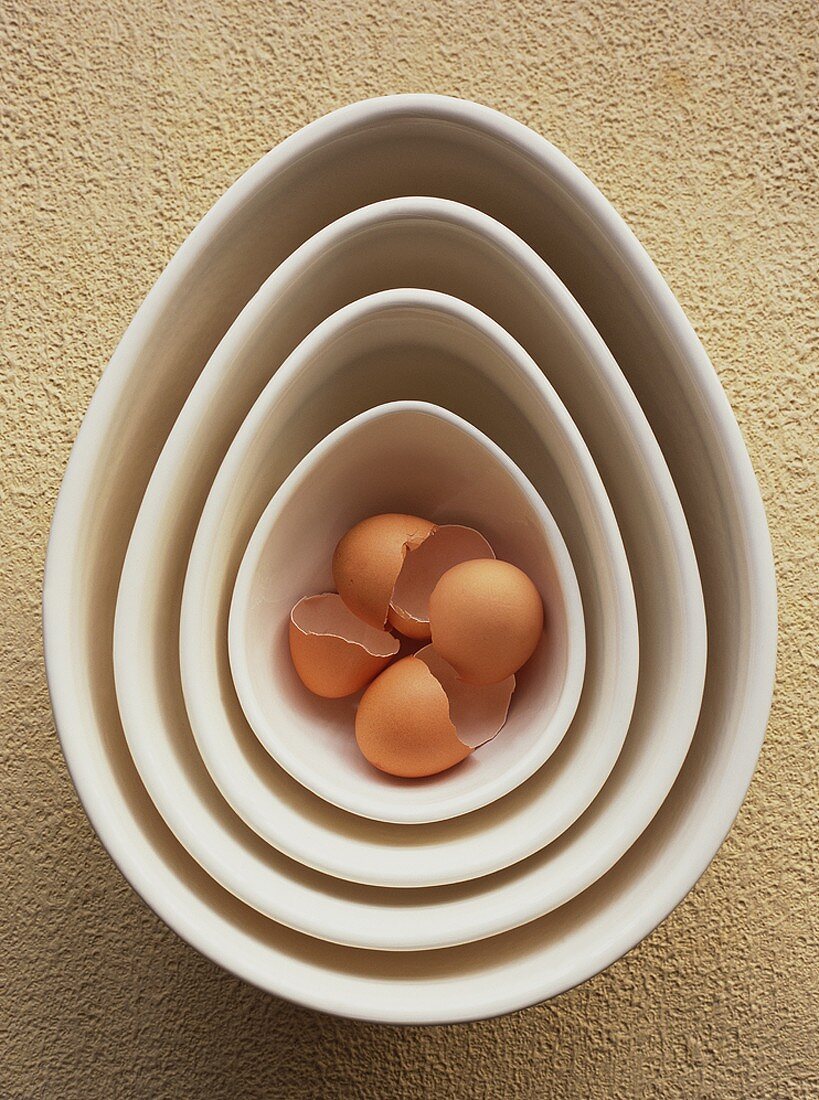 Brown eggshells in nested dishes