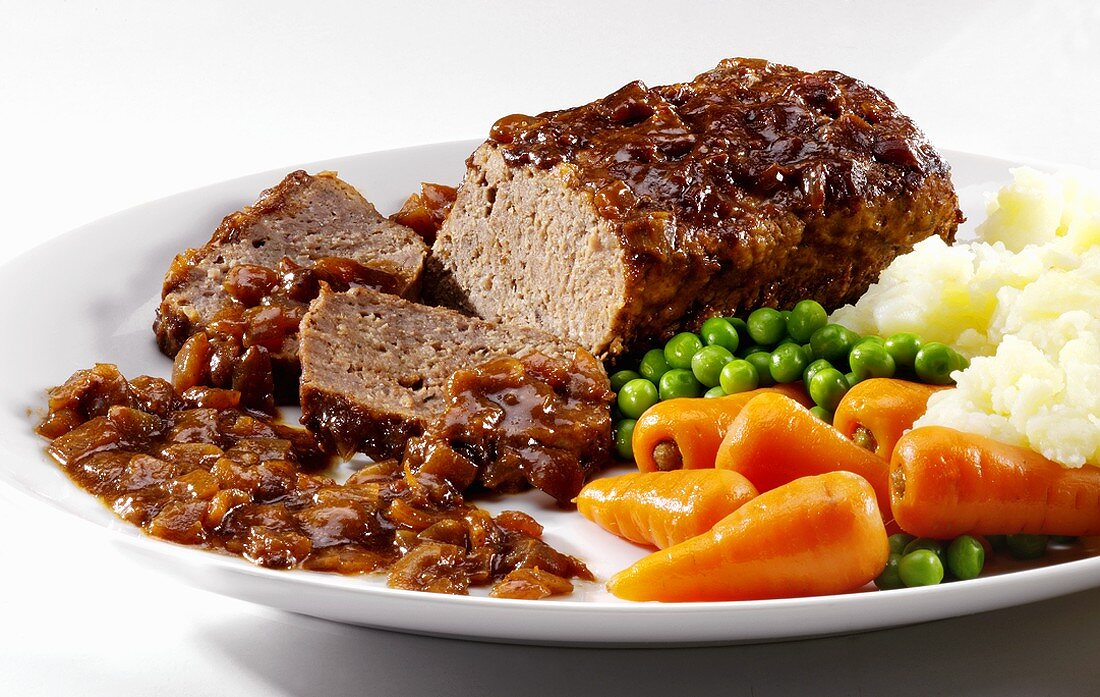 Meatloaf with carrots, peas and mashed potato