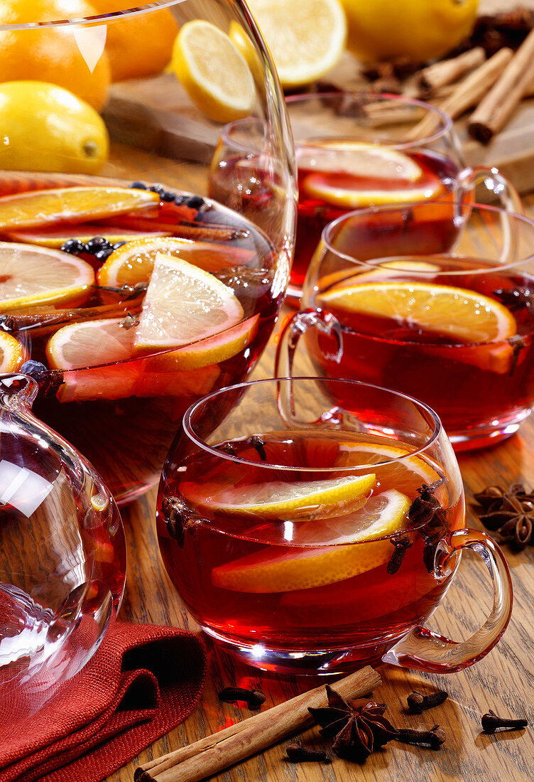 Mulled wine in punch bowl and glass cups