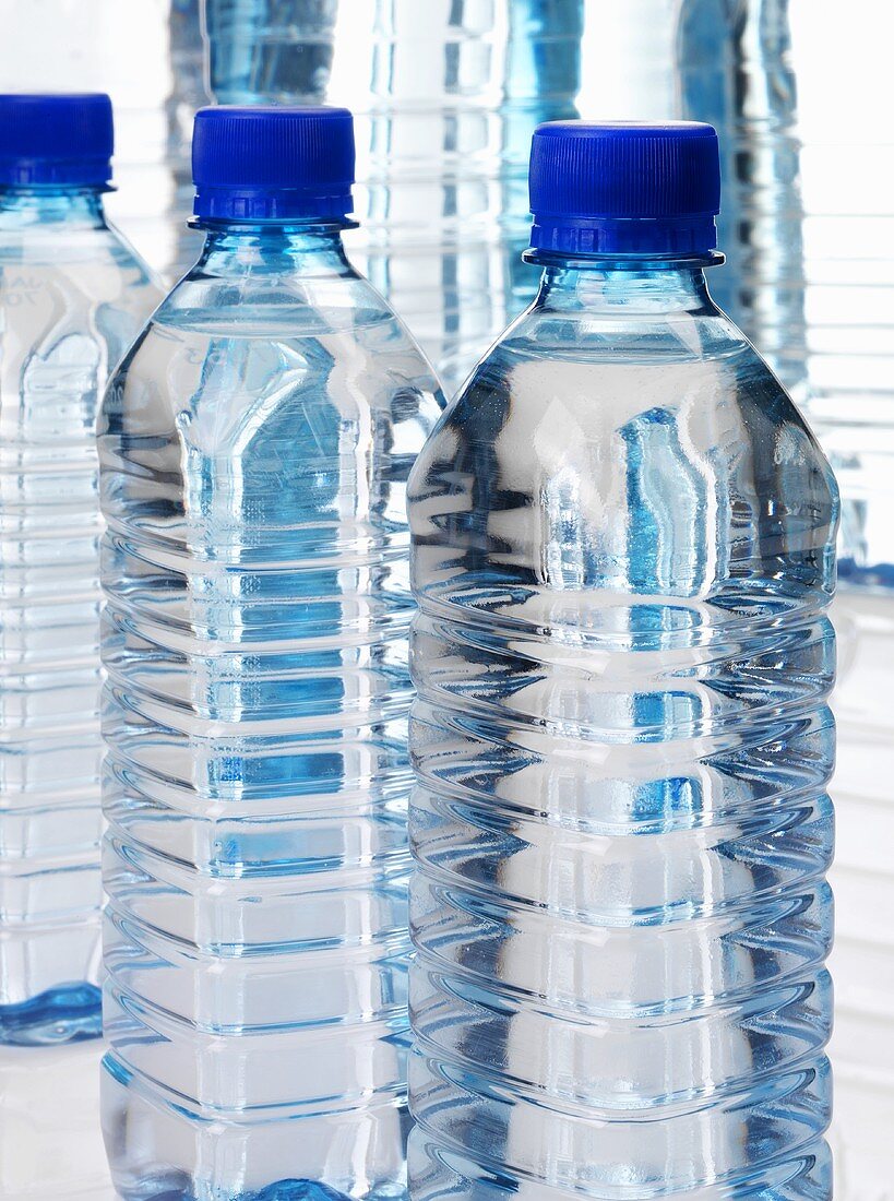 Three plastic water bottles