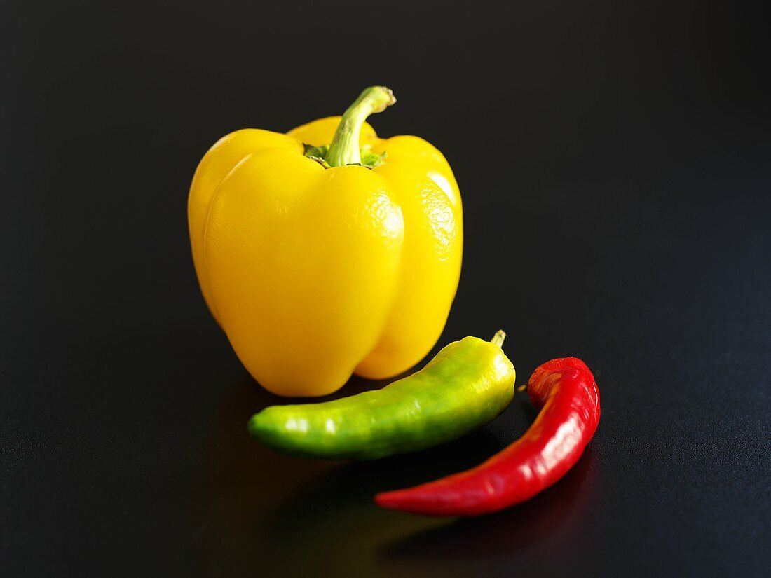 Green and red chillies with yellow pepper