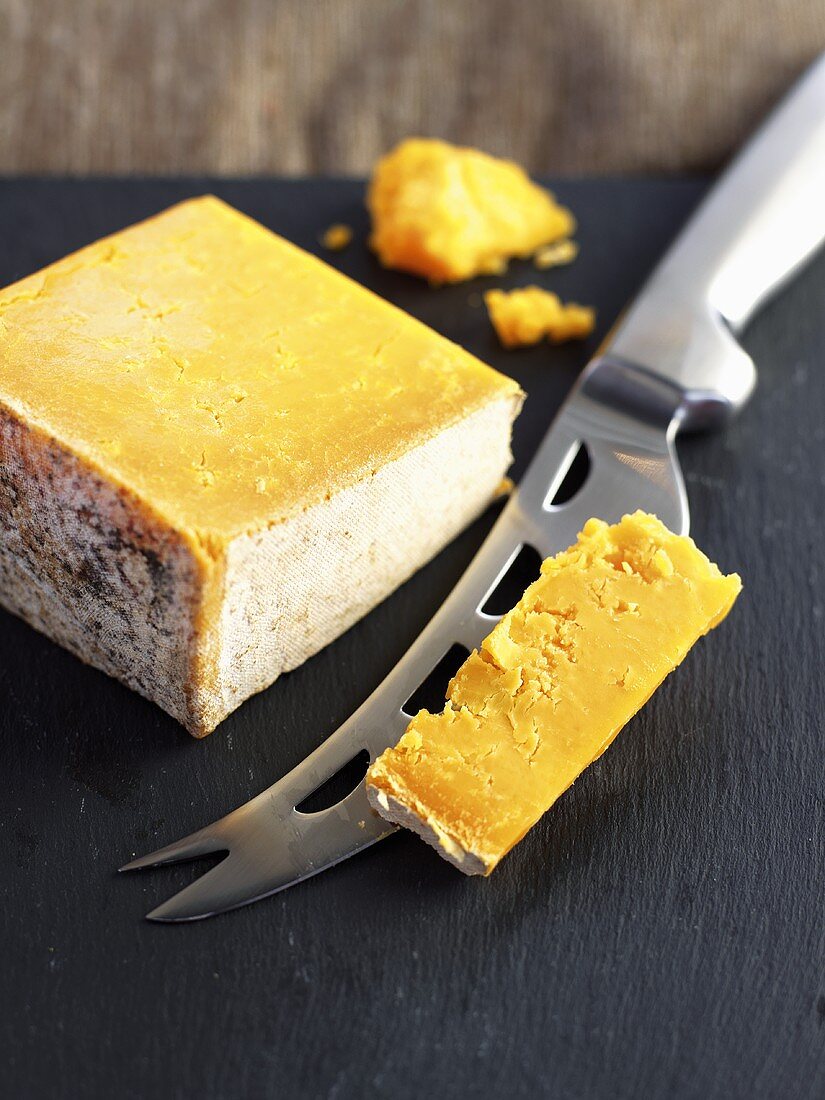 Double Gloucester with cheese knife (Semi-hard cheese, England)