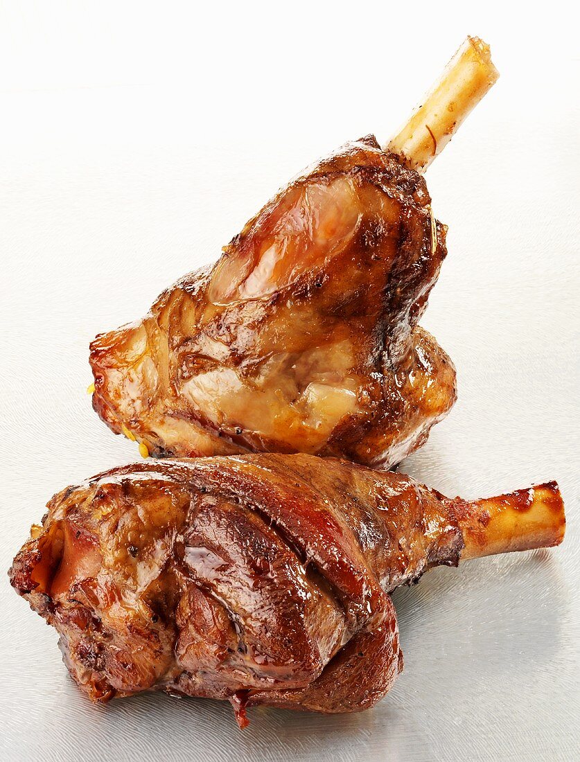 Two braised legs of lamb