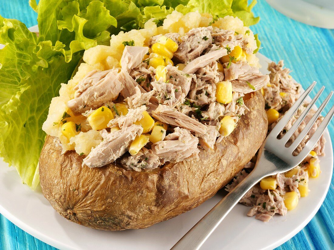 A baked potato with tuna and sweetcorn