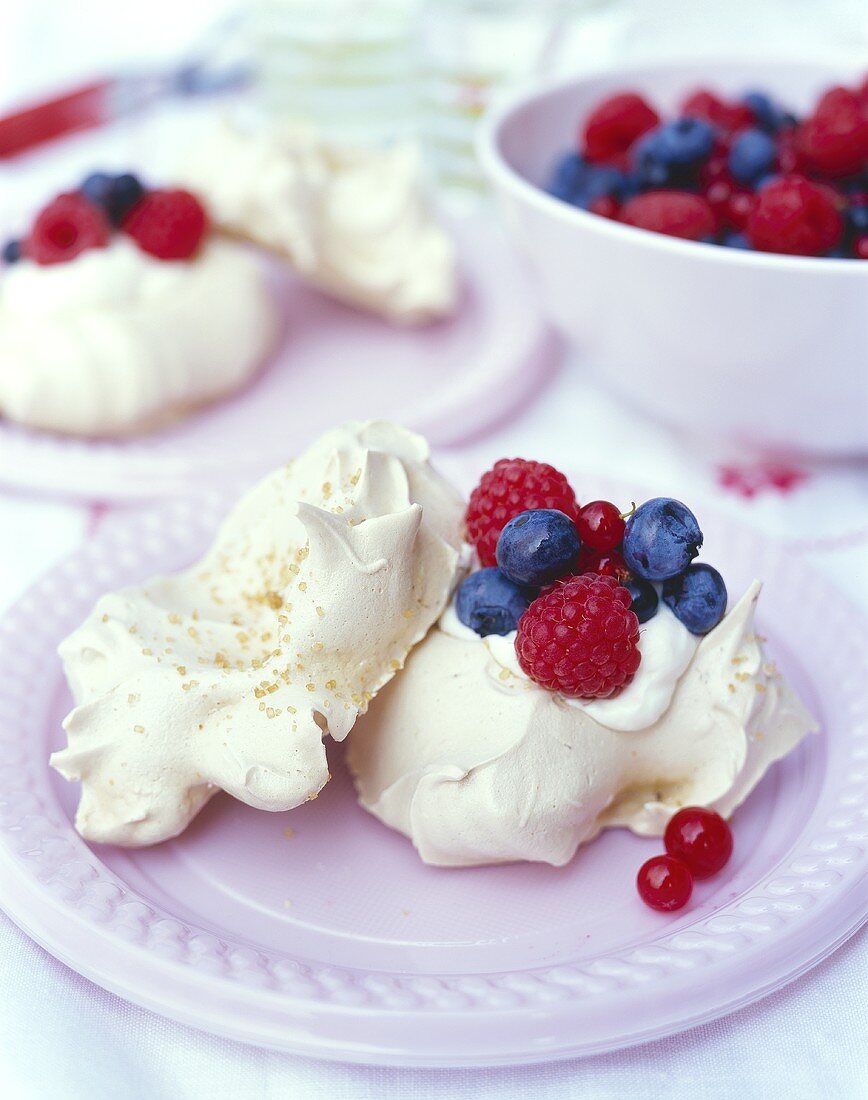 Coffee meringues with whipped cream and fresh berries