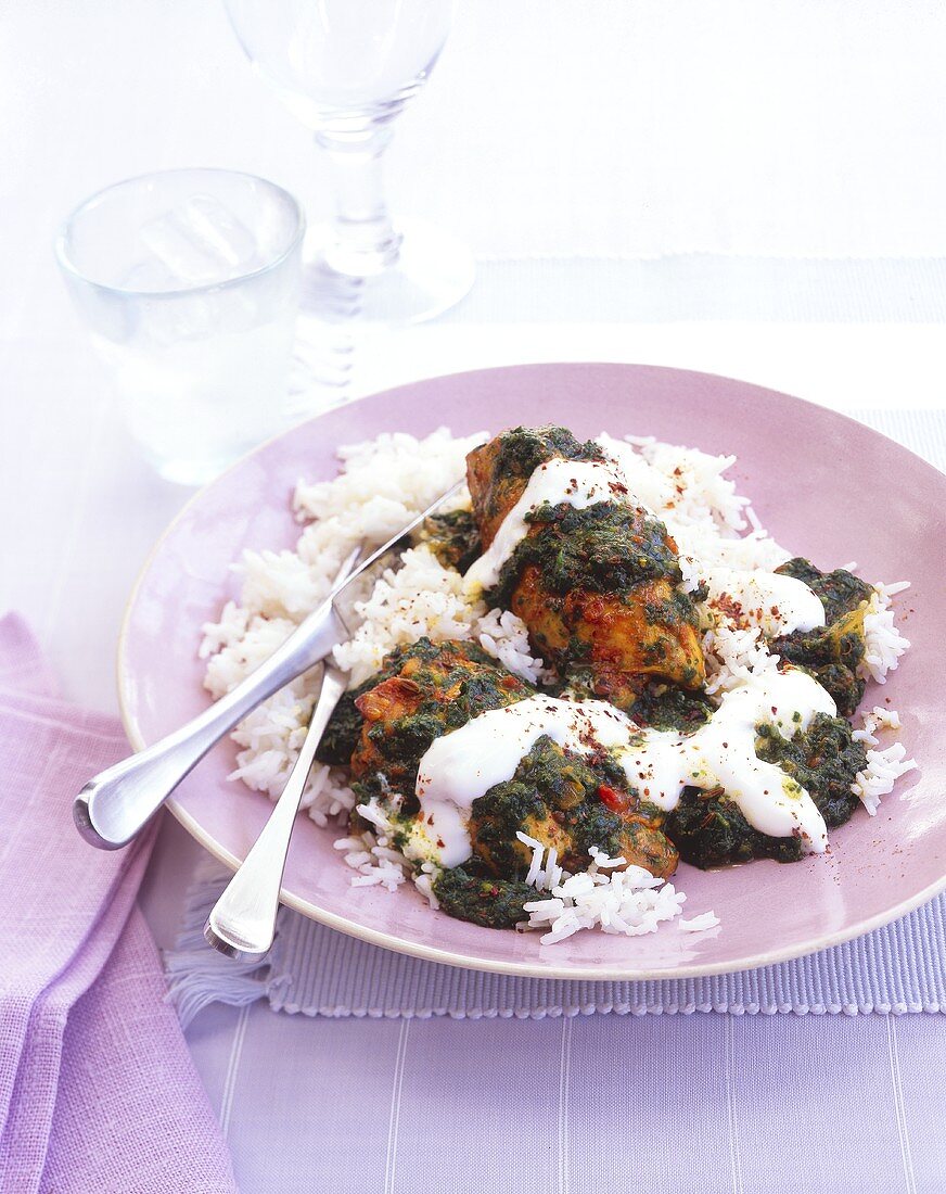 Chicken legs with Middle Eastern spices, spinach on rice