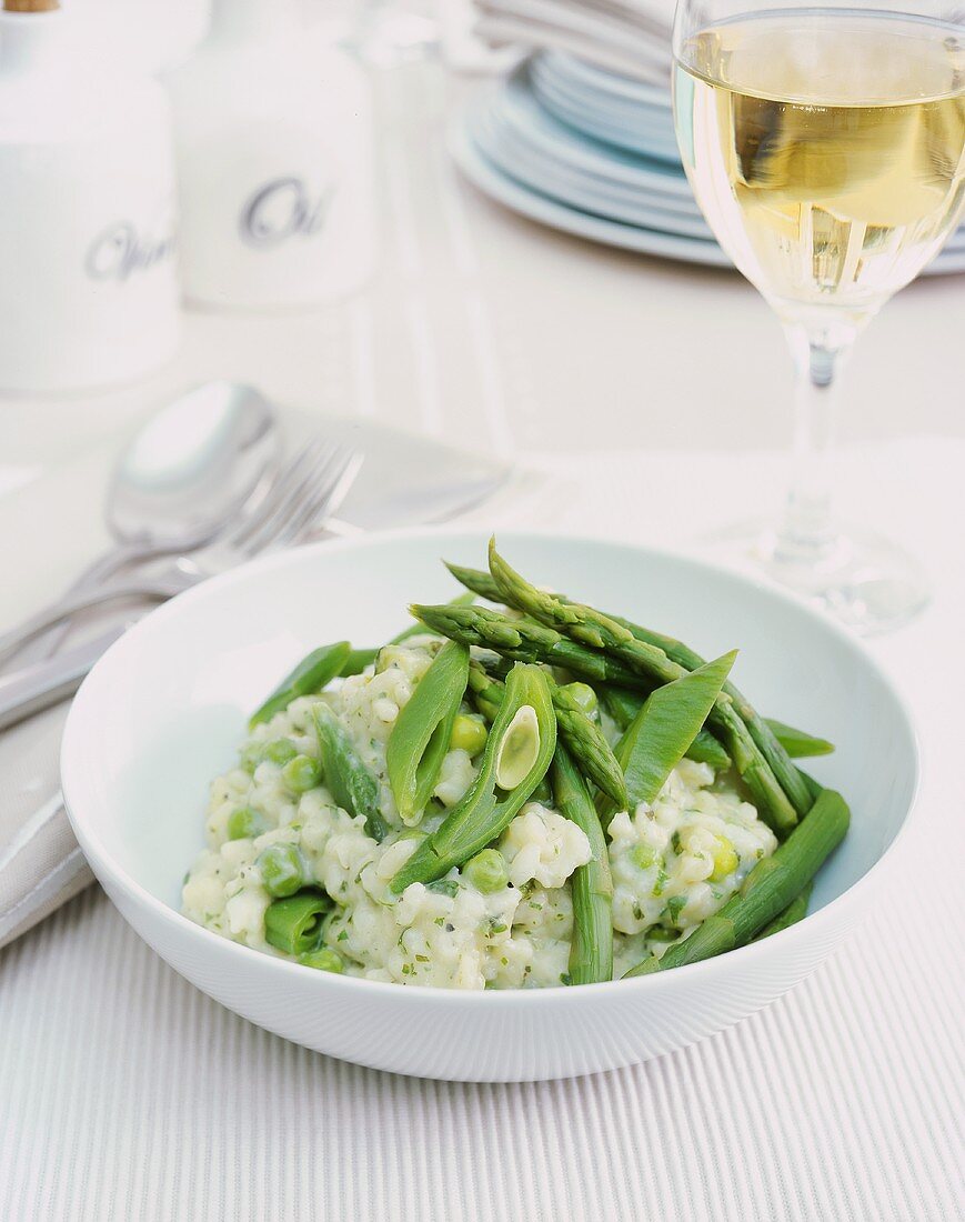 Risotto with green vegetables: asparagus, peas, beans