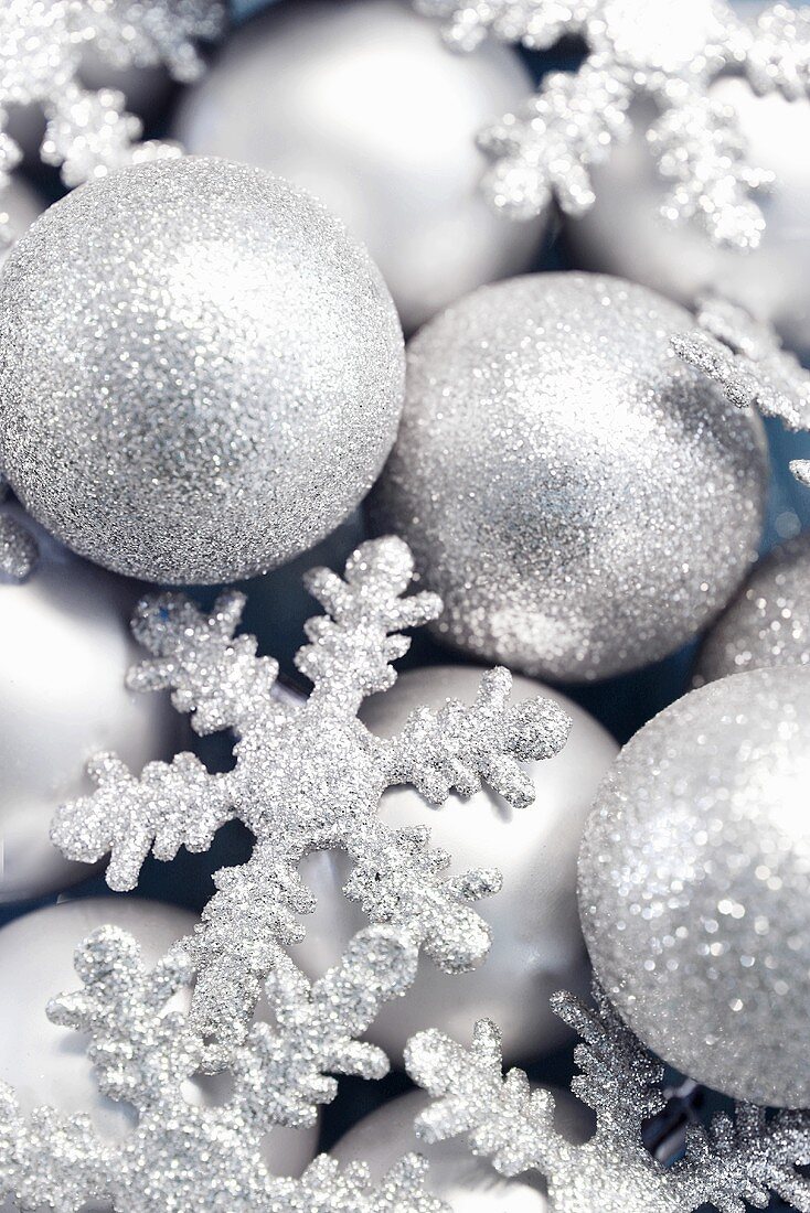 Silver Christmas baubles and snowflakes, full-frame