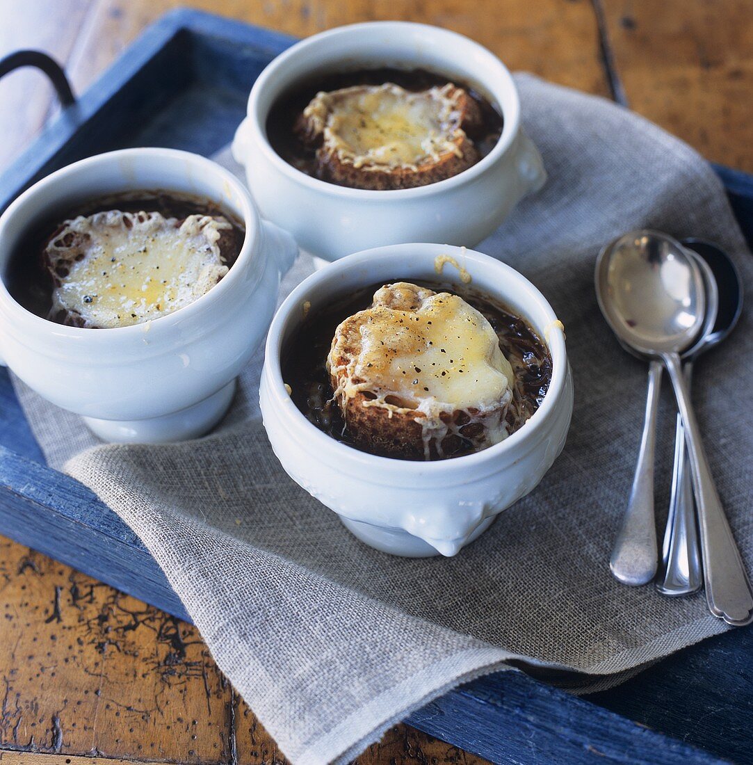 French onion soup in three bowls (seen from above)