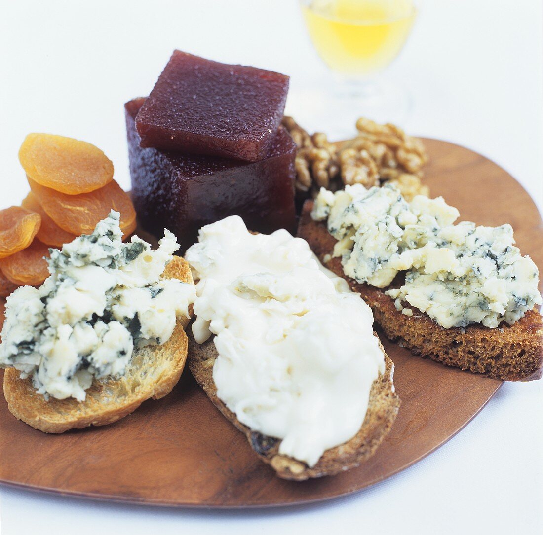 Various cheeses on toast with walnuts, apricots & port jelly