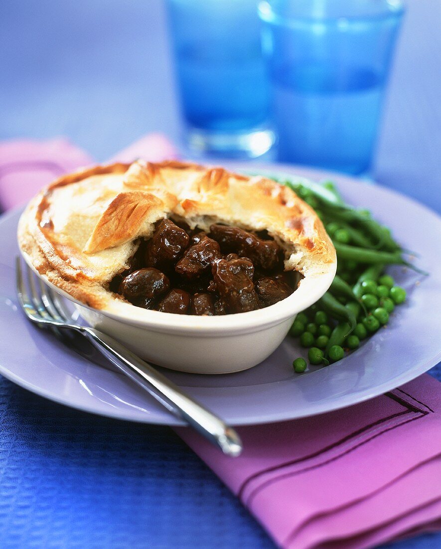Steak and kidney pie with beans and peas
