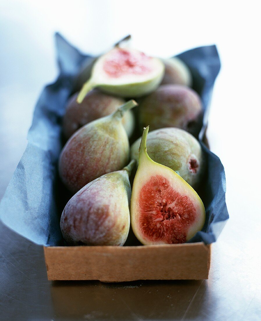 Box of fresh figs, whole and one halved