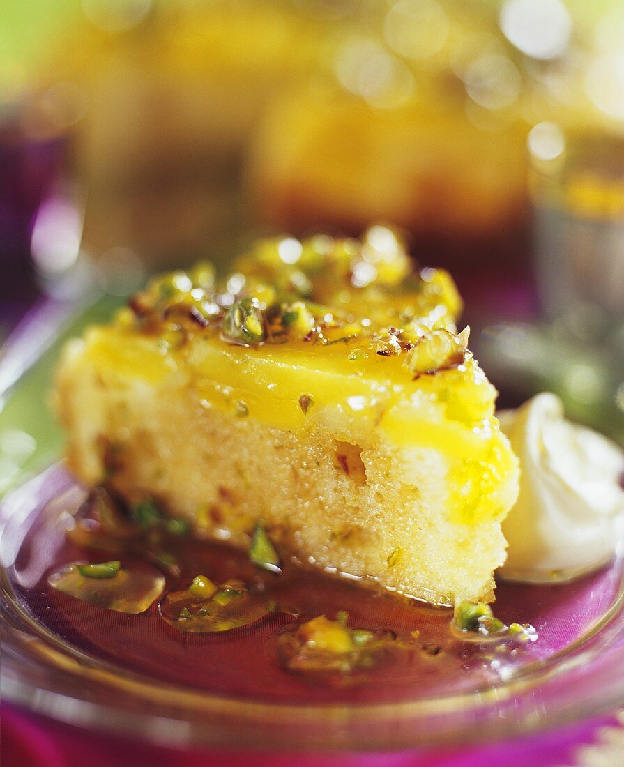 A piece of moist lemon cake with nuts