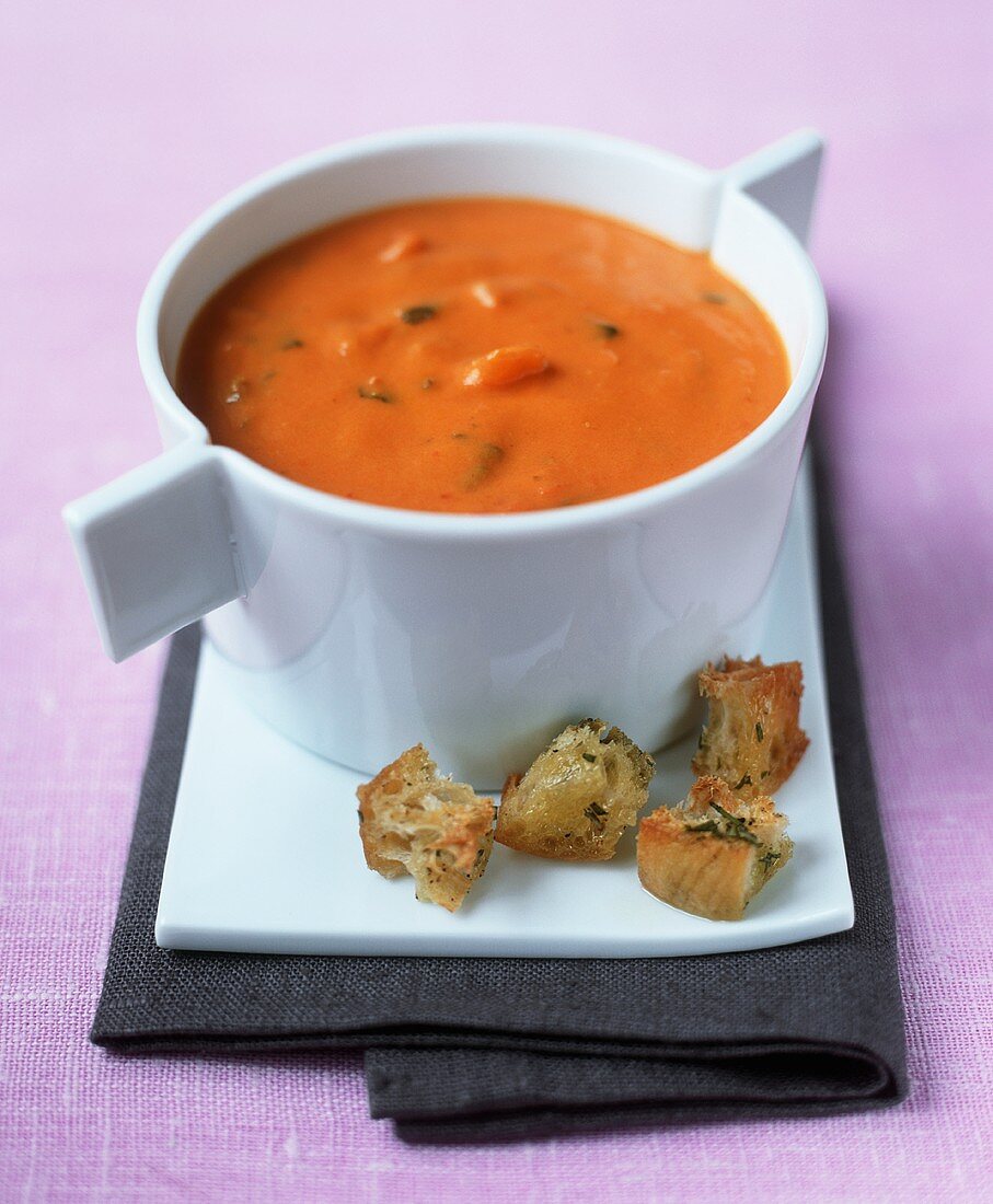 Cream of tomato soup with herb croutons