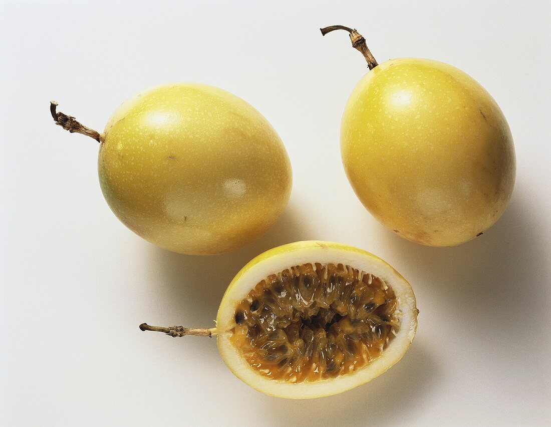 Two Whole Passion Fruit; Half of a Passion Fruit