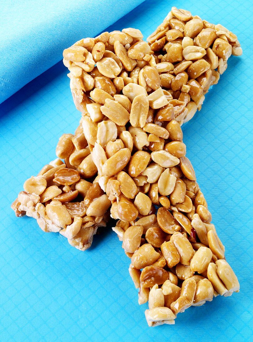 Two peanut bars on blue background