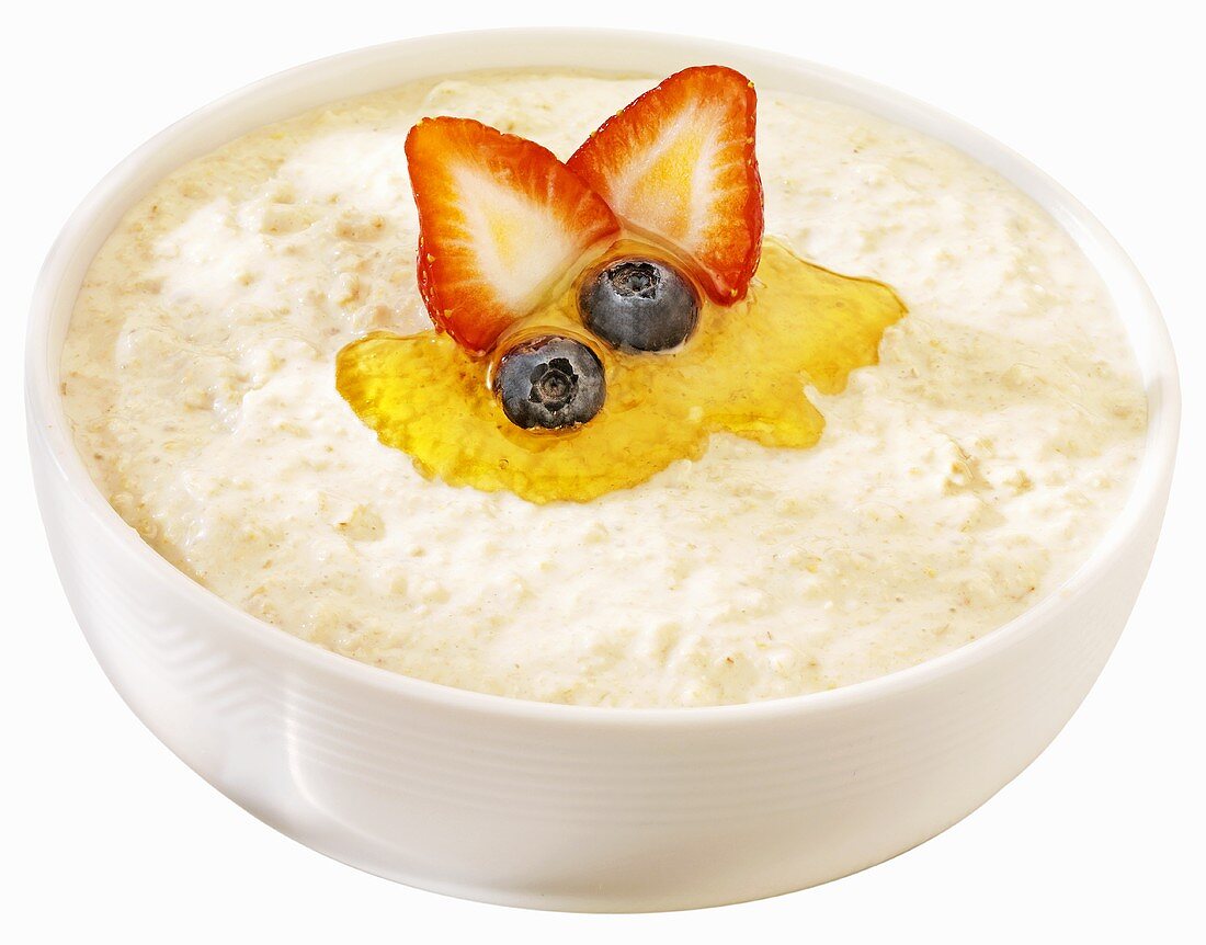 Porridge with honey, strawberry and blueberries