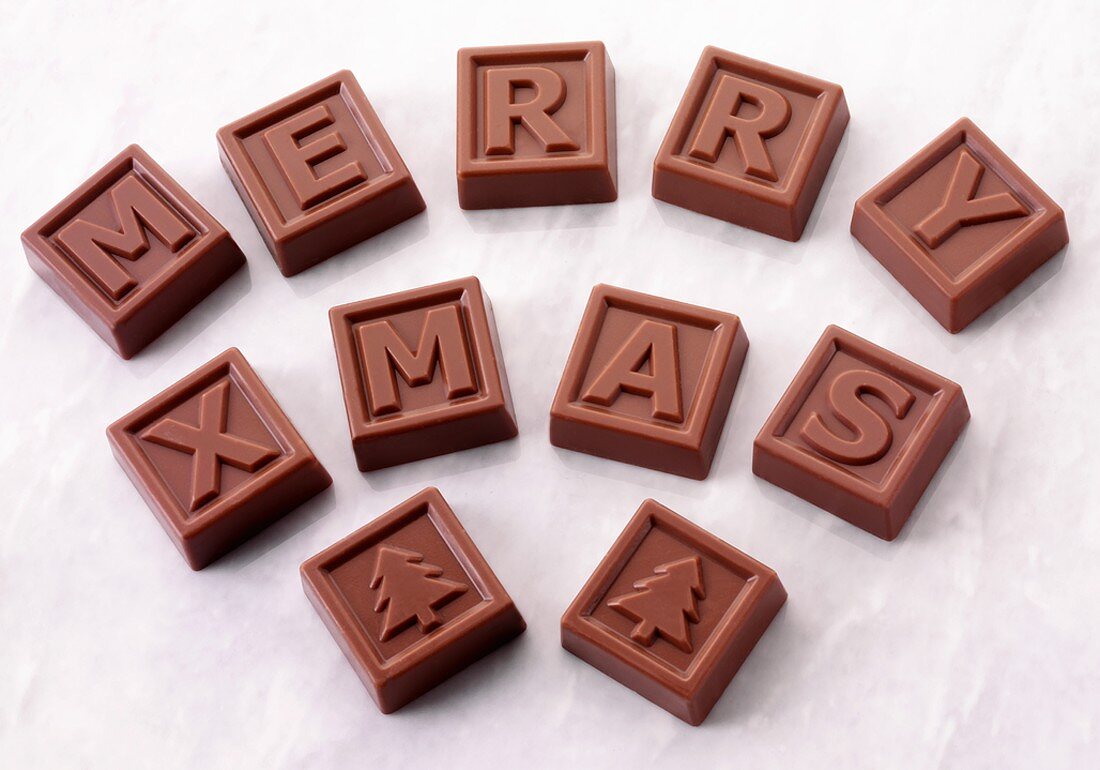 Chocolate squares with letters spelling 'Merry Xmas'