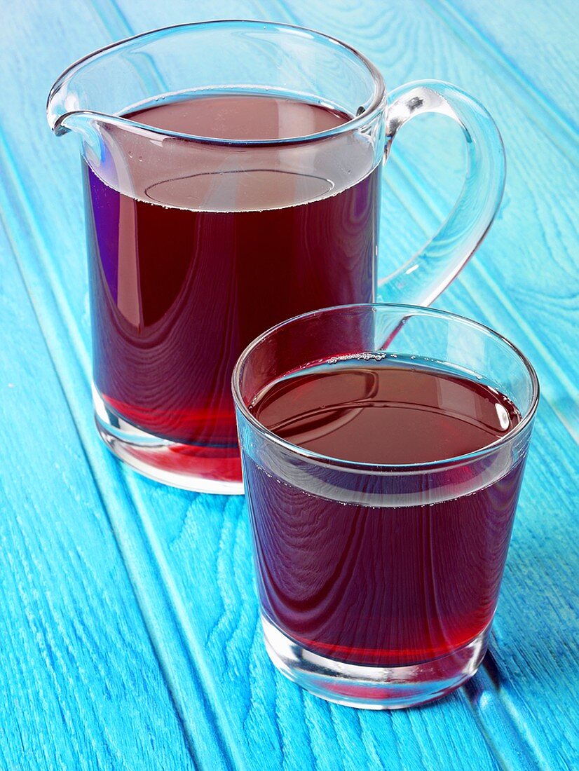 Cranberry juice in glass and jug
