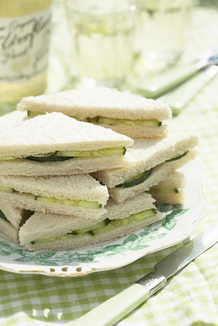 Cucumber sandwiches, stacked, on plate