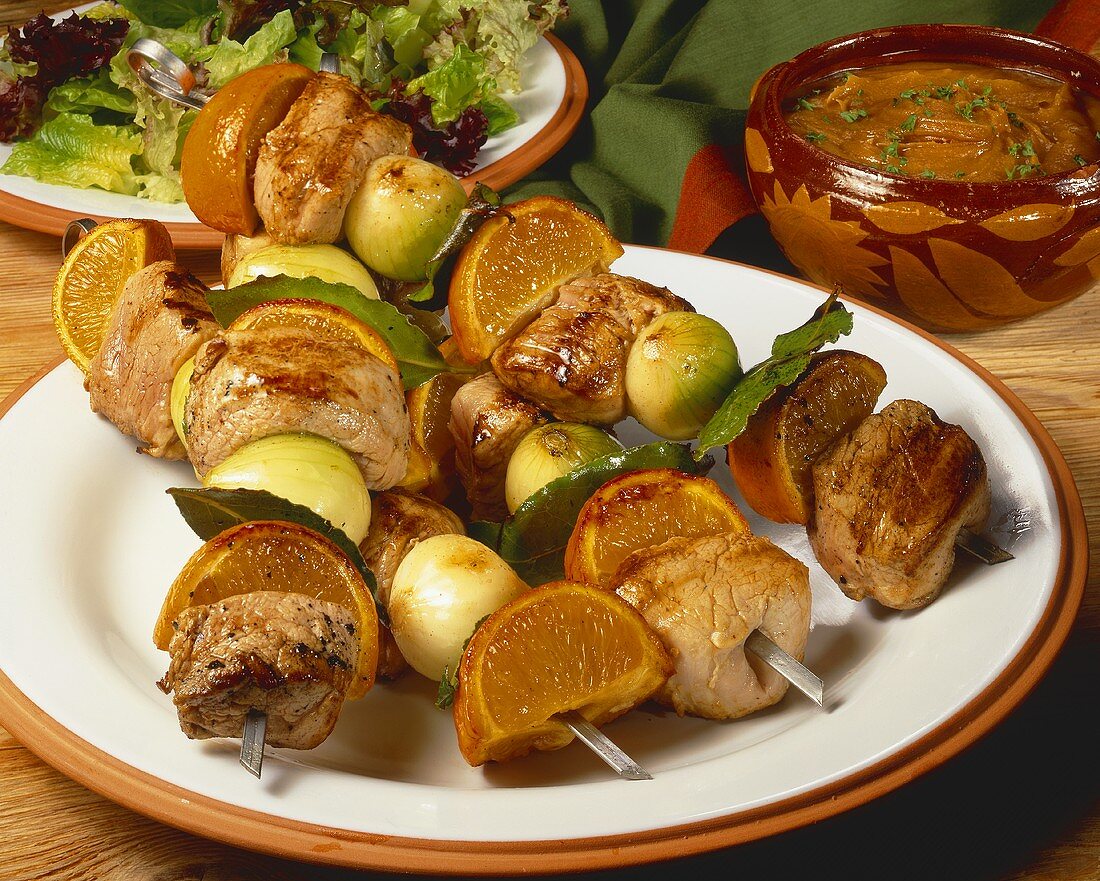 Pork and mandarin kebabs with onions