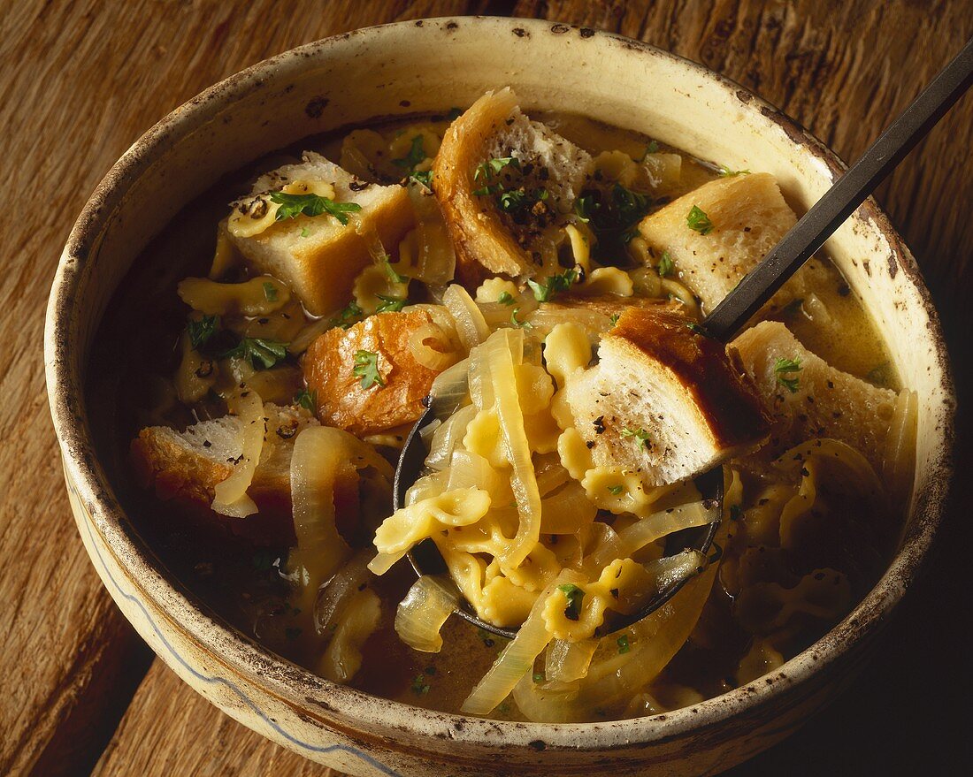 Onion soup with bread and pasta