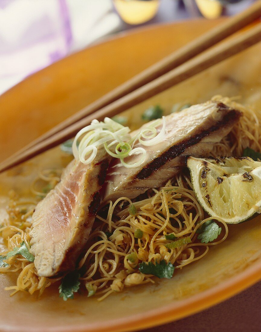 Grilled tuna steaks on Asian noodles with a ginger and soy sauce
