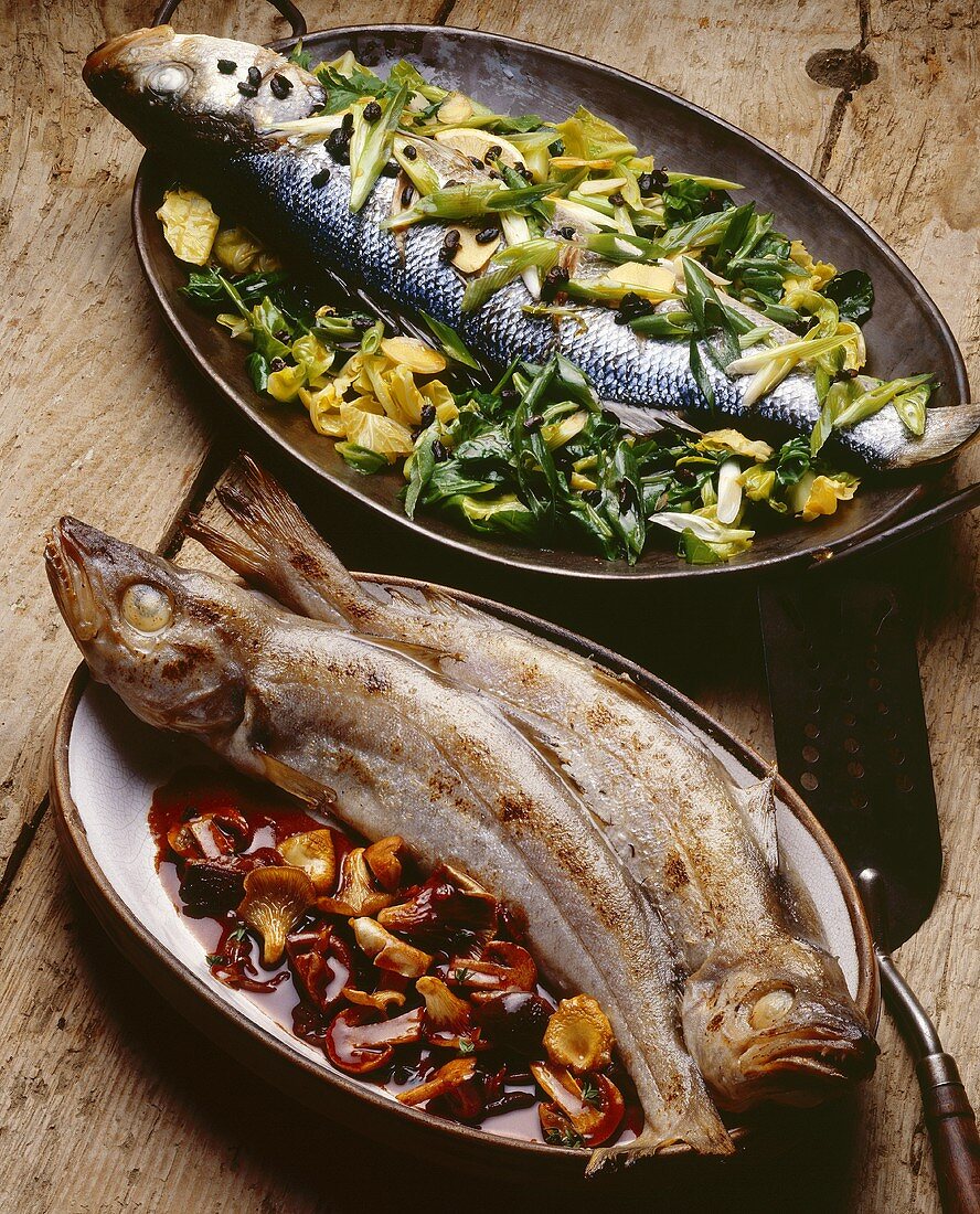 Baked sea bass with vegetables, and whiting with mushrooms