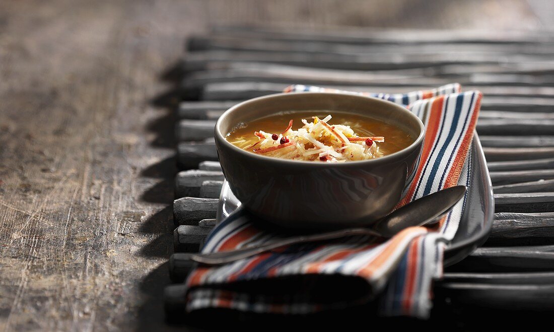 A bowl of lentil soup with cumin, carrot and apple