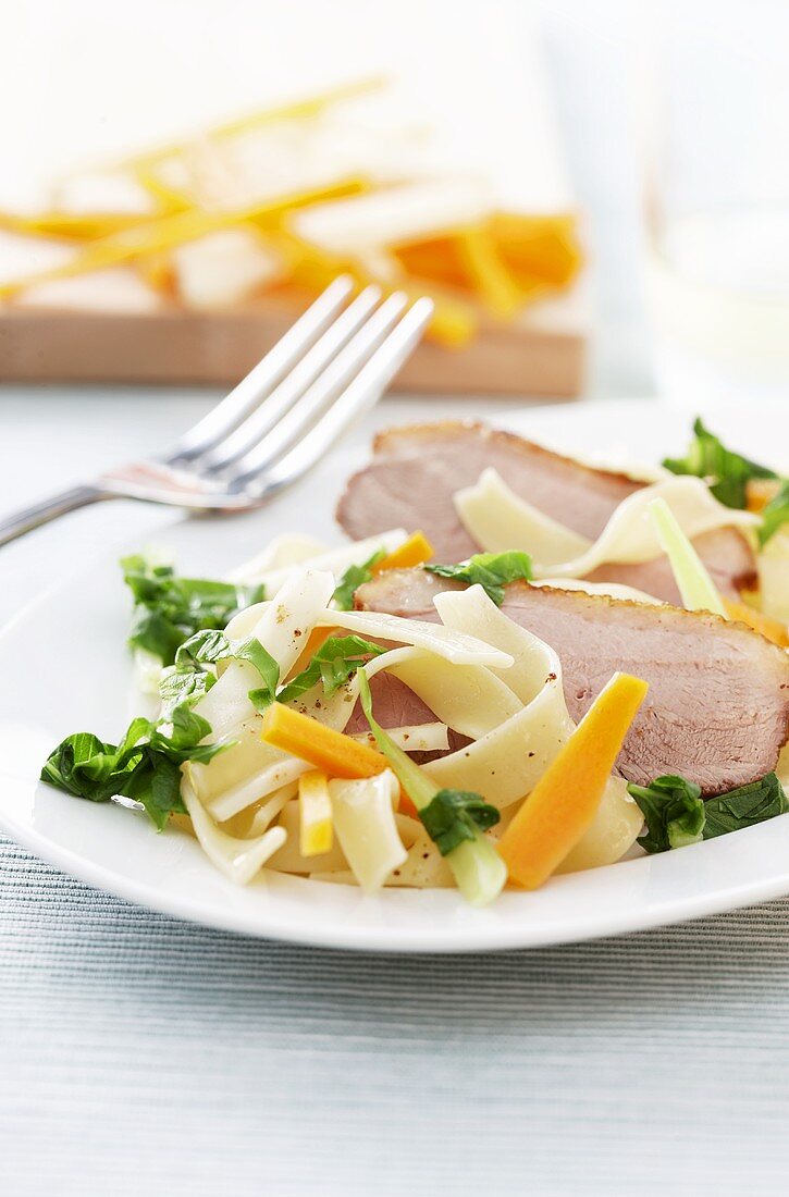 Duck breast with ribbon pasta and vegetables