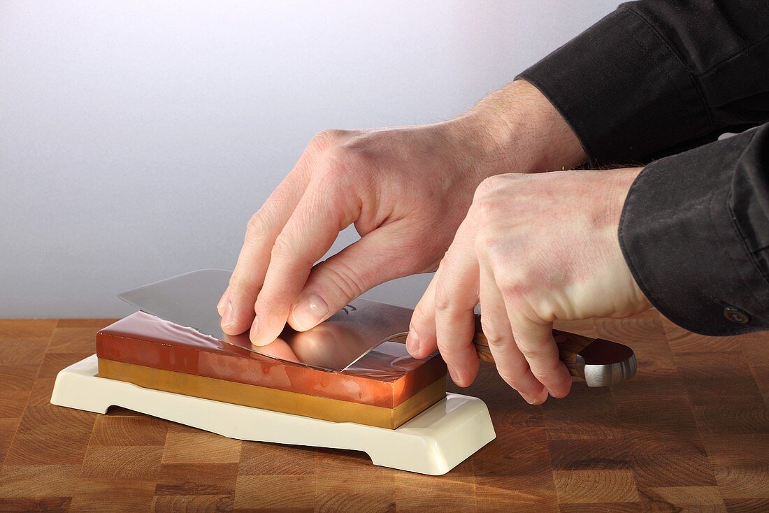 Sharpening a knife on a whetstone