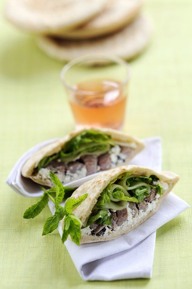 Pita bread filled with meat and mint