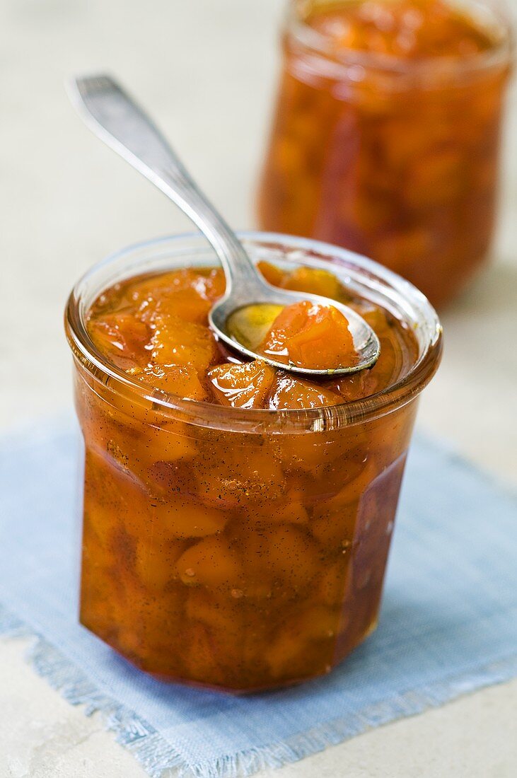 Pumpkin jam in jar with spoon
