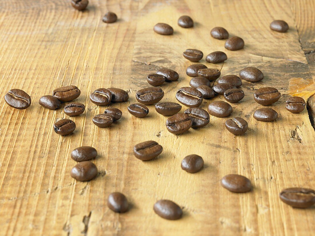 Coffee beans on wooden background