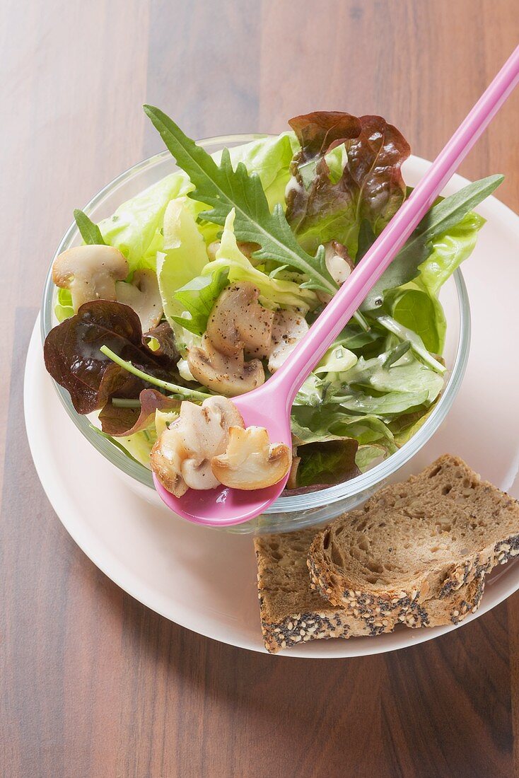 Salad leaves with button mushrooms