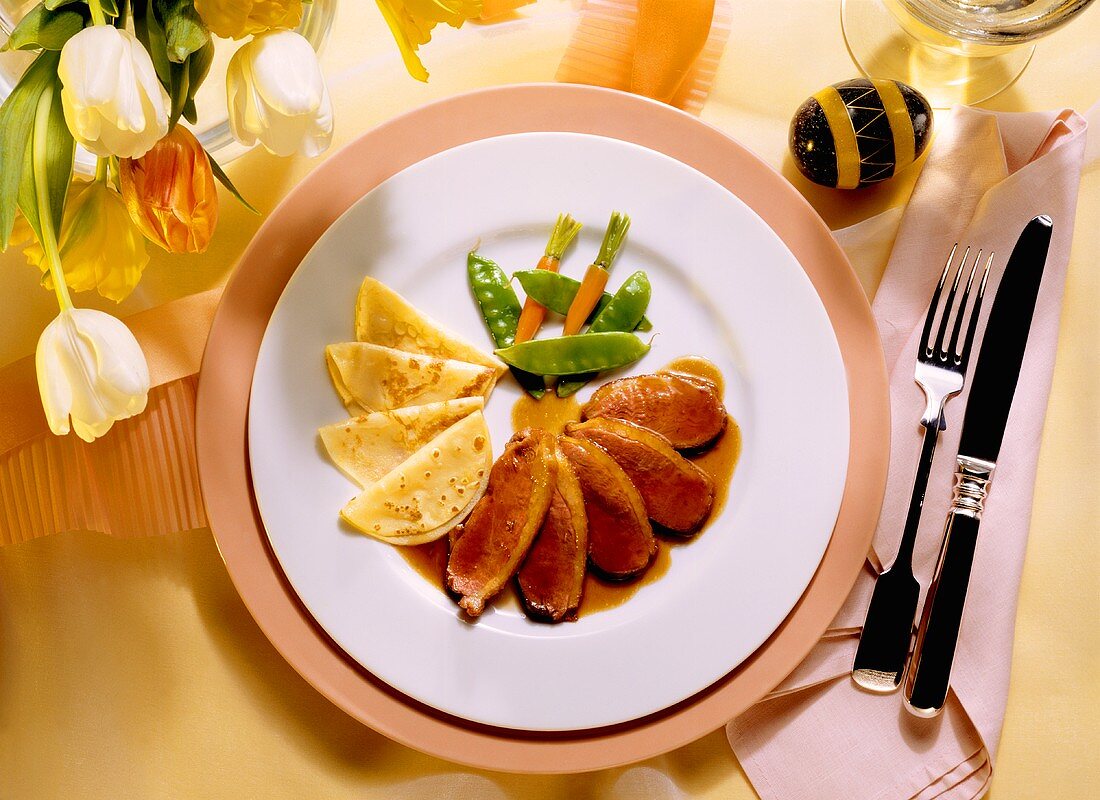 Sliced Duckling Breast with Crepes and Vegetables on Orange Sauce