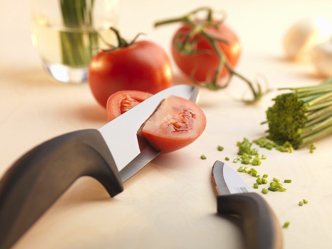 Tomatoes and chives, partly cut