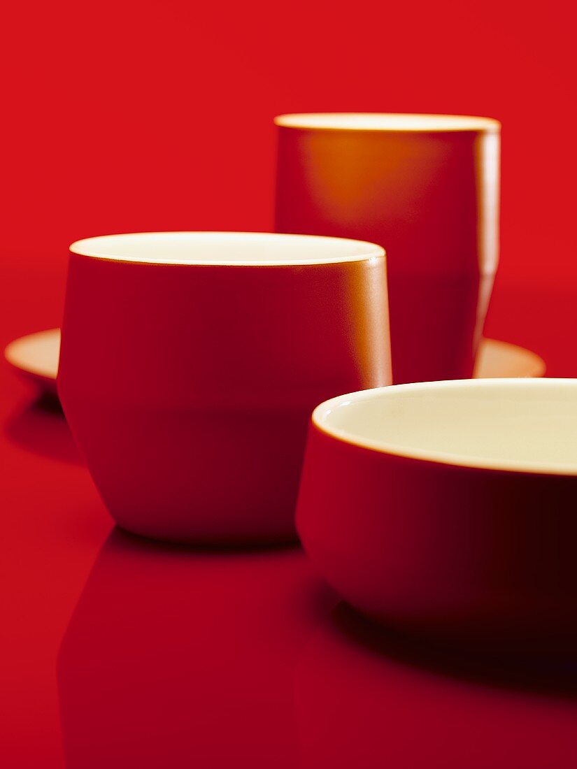 Various red bowls and beakers