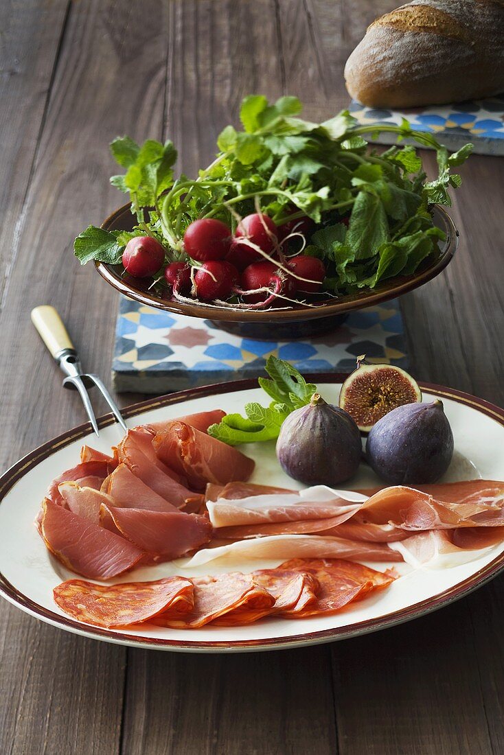 Ham platter with figs and radishes