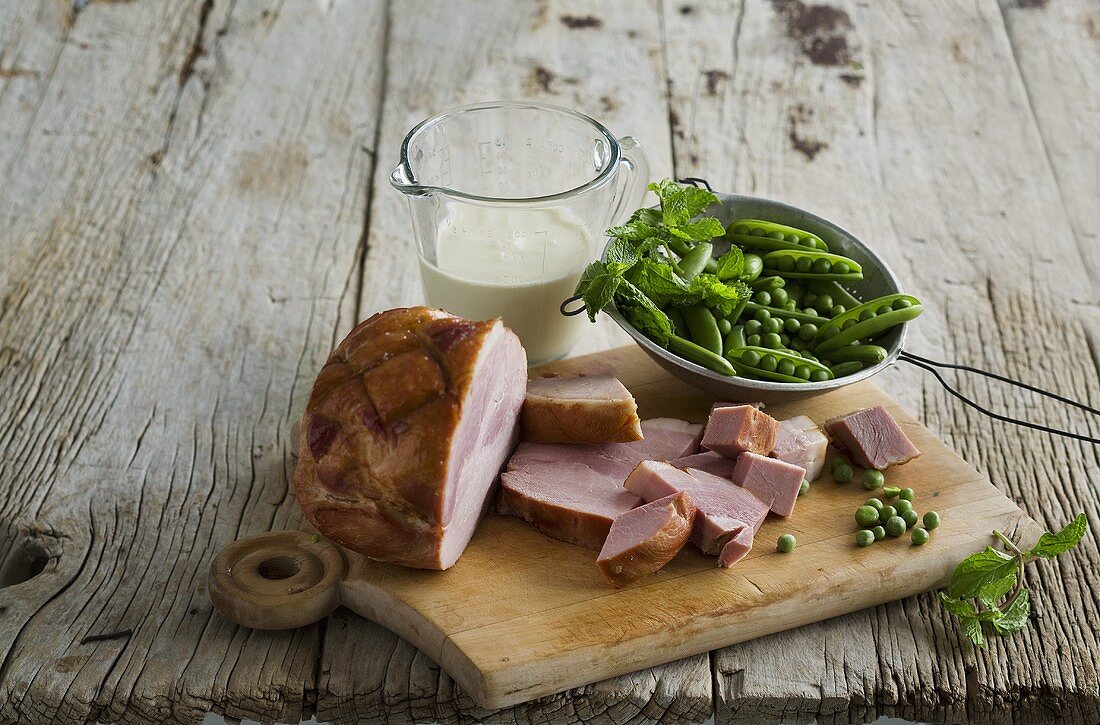 Ham and peas on a wooden board