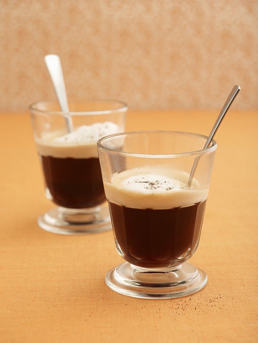 Coffee with cream topping in glasses