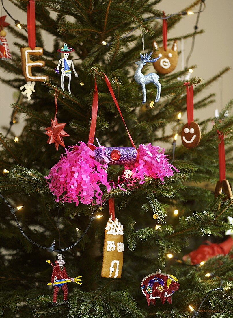 Christmas tree decorated with ornaments, biscuits & sweets