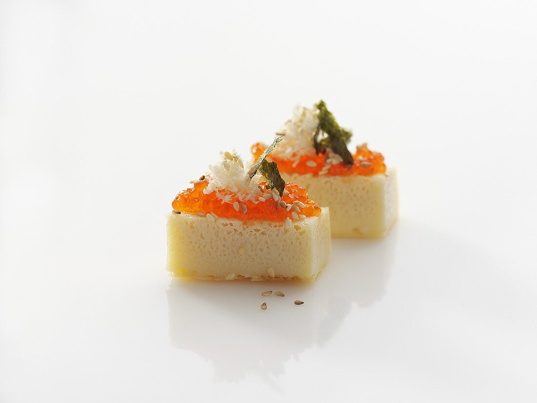 Pieces of Eierstich (egg custard) topped with keta caviar
