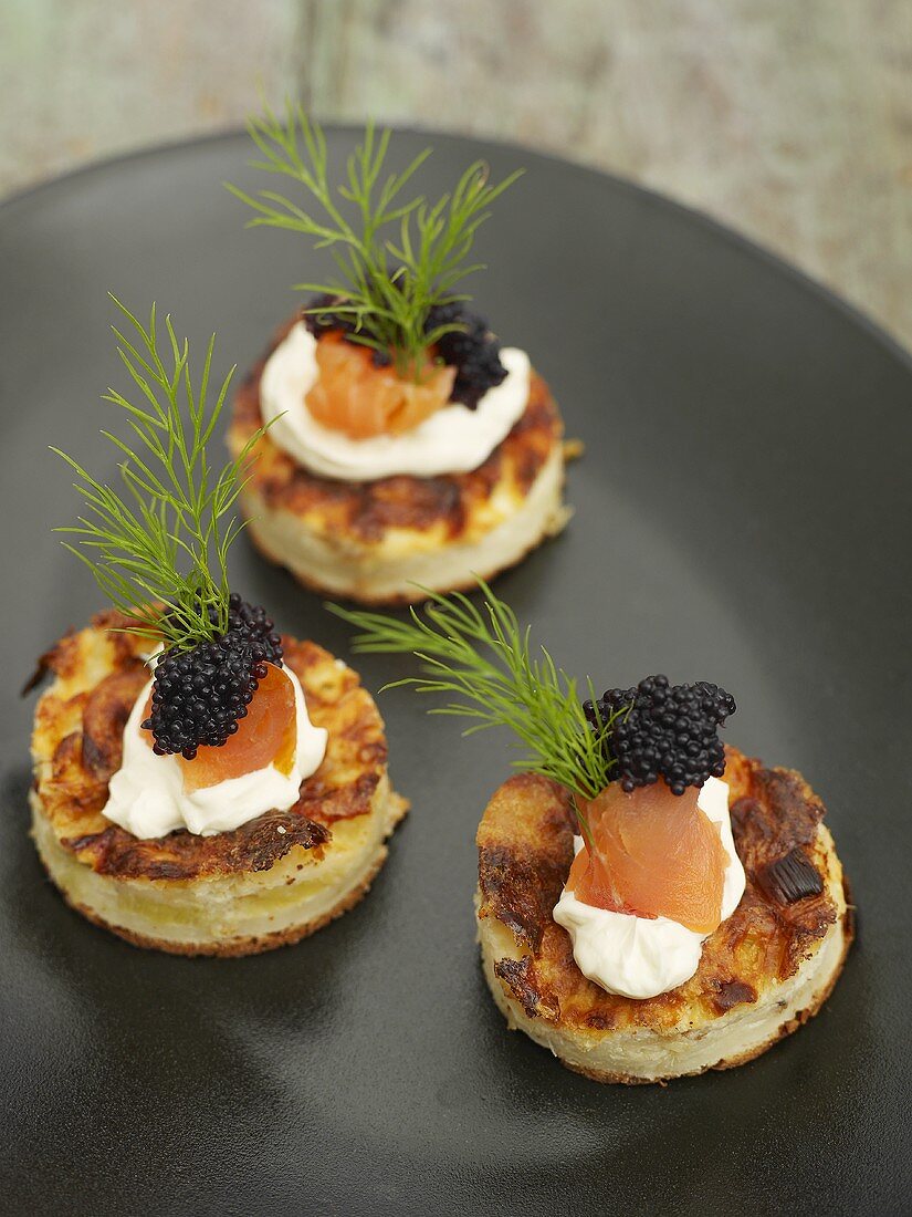 Small tortillas with soft cheese and caviar
