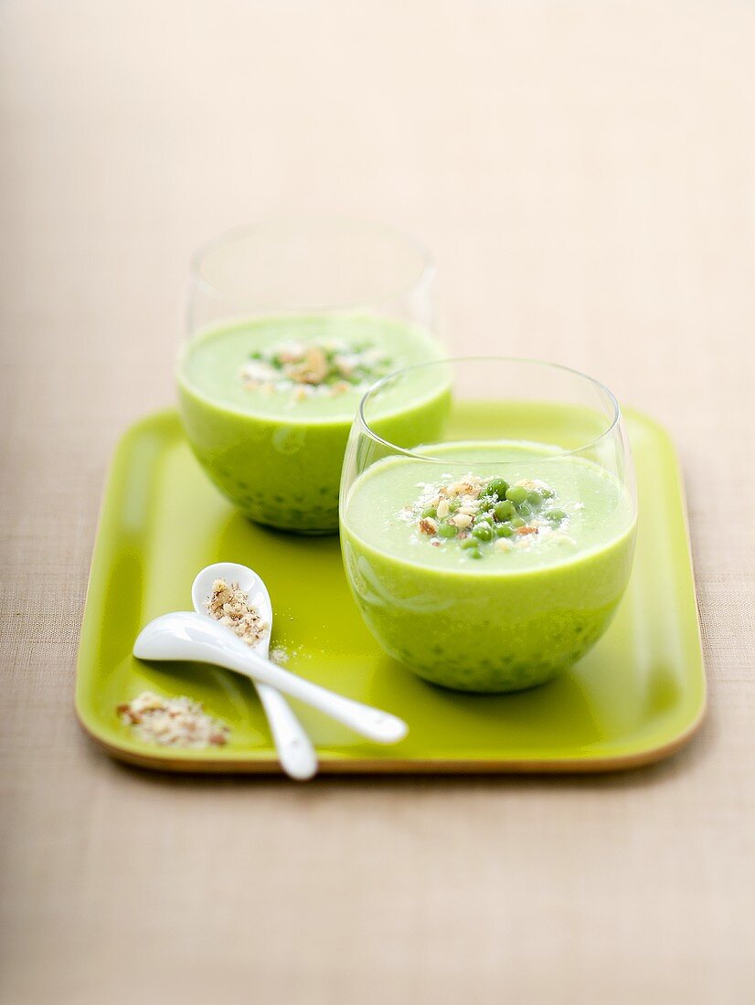 Cream of pea soup in two glasses