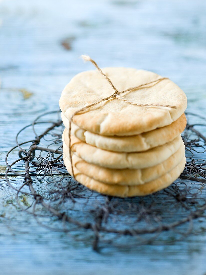 Stack of pita bread tied with kitchen string
